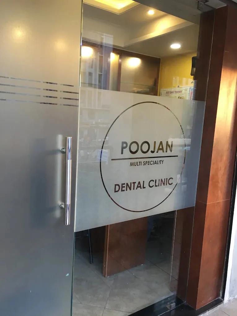 The entrance of Poojan Multi Speciality Dental Clinic in Gota, Ahmedabad