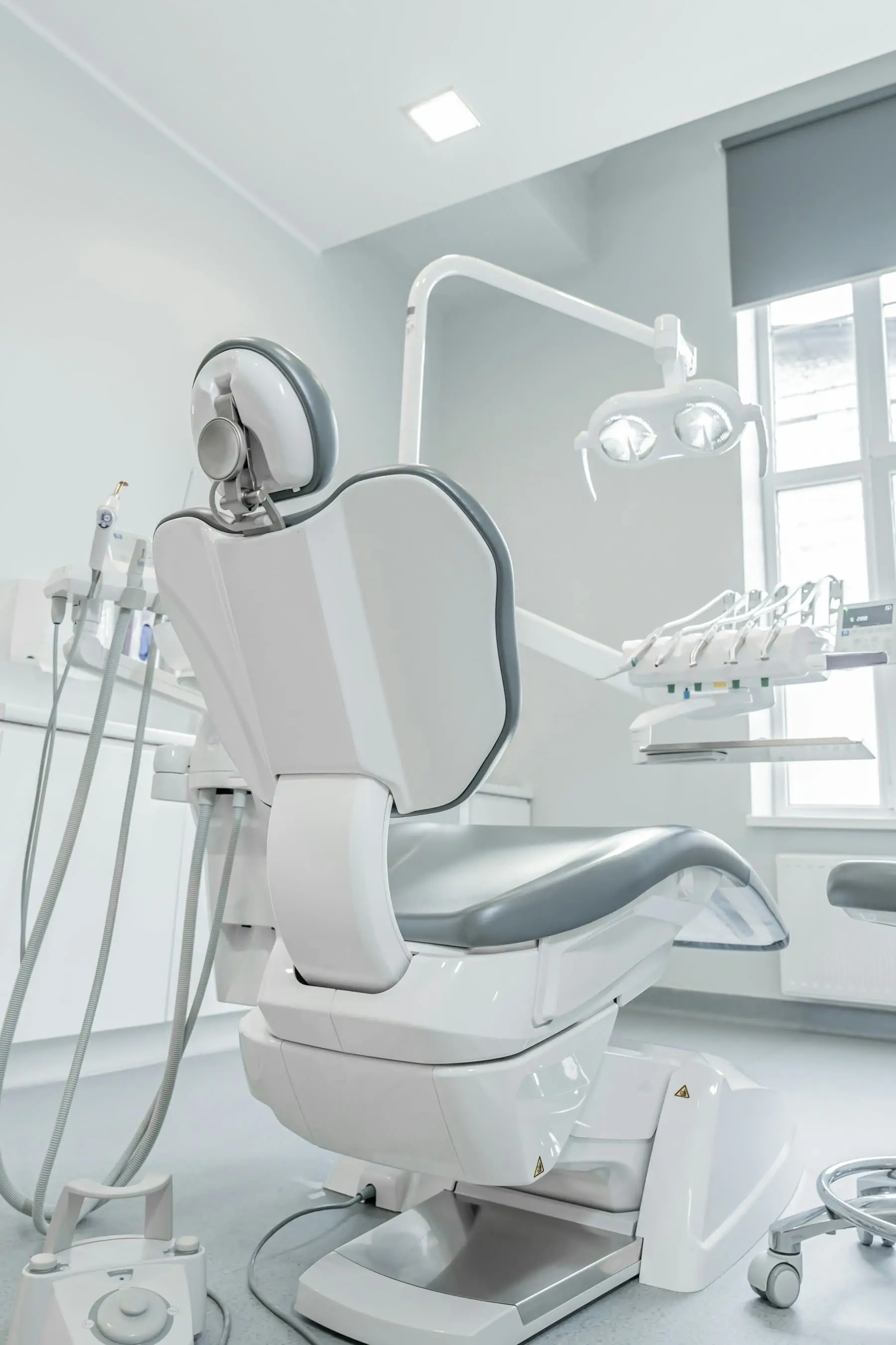 A dental chair by a window