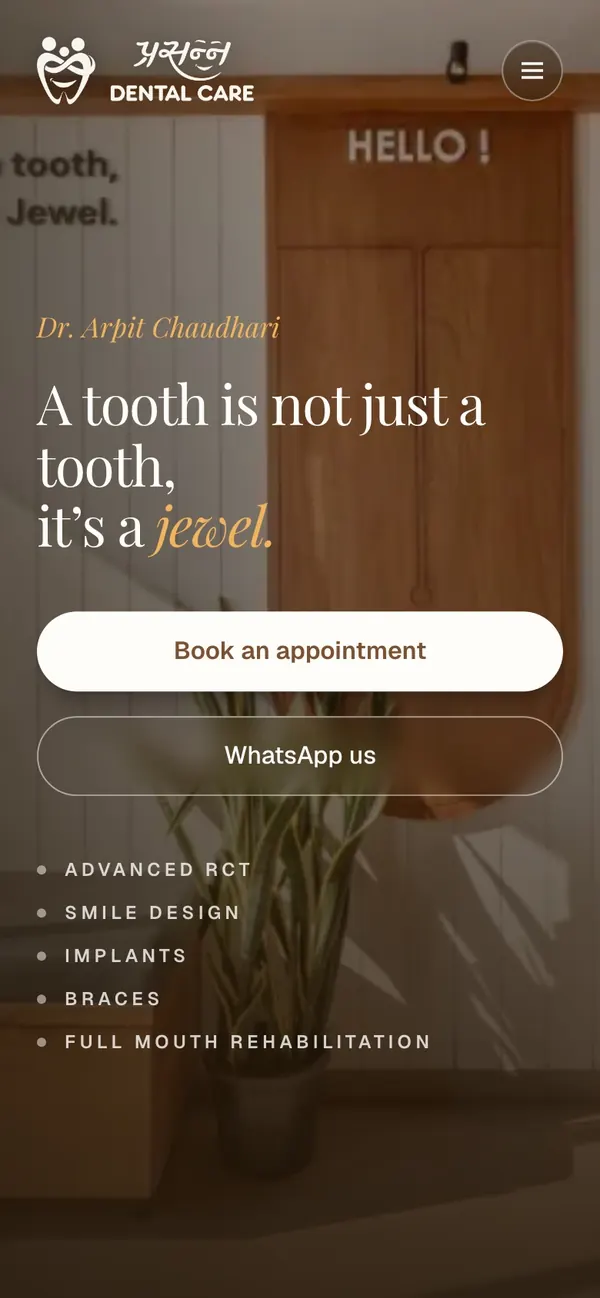 Prasanna Dental Care website on a phone